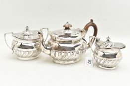 A VICTORIAN THREE PIECE SILVER TEA SET, a tea pot, milk jug and lidded sugar pot, part lobed
