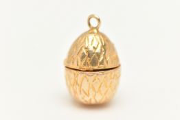 A 9CT GOLD EGG AND CHICK CHARM, yellow gold egg with hinged fittings opening up to reveal an