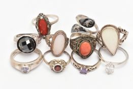 AN ASSORTMENT OF TEN RINGS, to include one silver band ring set with a heart cut cubic zirconia,