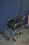 A DAYS MOBILITY FOLDING WHEELCHAIR with cushion and two footrests