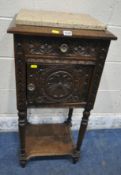 A 20TH CENTURY OAK POT CUPBOARD, with a single drawer, above a cupboard door, with geometric