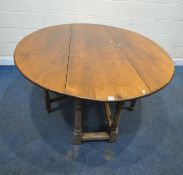 AN 18TH CENTURY STYLE OAK WAKE TABLE, raised on block and turned legs, open width 143cm x closed