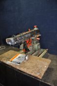 A DeWALT DW 125 RADIAL ARM SAW with a 12in blade, 240 volt (PAT fail due to uninsulated plug but