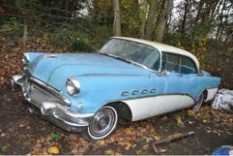 A 1956 BUICK RIVIERA FOUR DOOR COUPE CAR, in blue and white with matching vinyl interior, a 6000cc