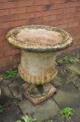 A LARGE WEATHERED CERAMIC CAMPAGNA STYLE GARDEN URN, with a fluted bowl, height 77cm, Condition