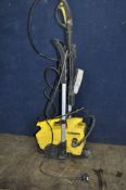 A KARCHER 411A PRESSURE WASHER with lance, patio head and four nozzles (PAT pass and working)