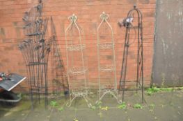 A COLLECTION OF MODERN METAL GARDEN STRUCTURES. Including a set of three graduated obelisks, two