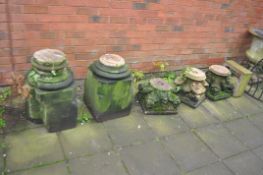 A COLLECTION OF SANDSTONE ARCHITECTURAL COLUMN PARTS including two bases and three tops with