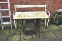 A CAST IRON SINGER TREADLE BASE FITTED WITH A WHITE MARBLE TOP and a vintage wrought iron garden