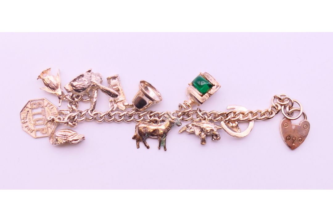 A collection of silver jewellery, to include a charm bracelet, a ring and a pair of earrings. - Image 2 of 14