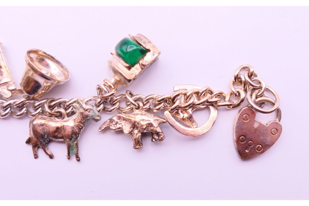 A collection of silver jewellery, to include a charm bracelet, a ring and a pair of earrings. - Image 4 of 14