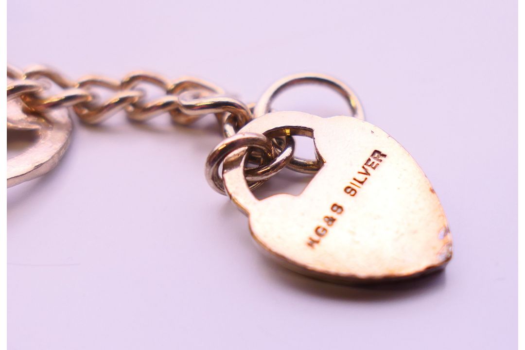 A collection of silver jewellery, to include a charm bracelet, a ring and a pair of earrings. - Image 5 of 14