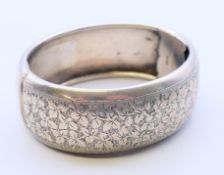 A silver bangle. 6 cm diameter. 38.4 grammes.