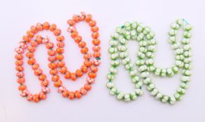 Two strings of Venetian glass beads. Each approximately 70 cm long.