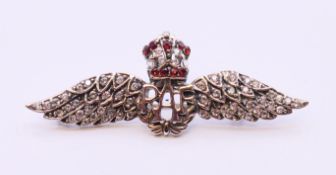 A silver RAF brooch. 5.5 cm x 2 cm.