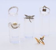 Five silver rings.