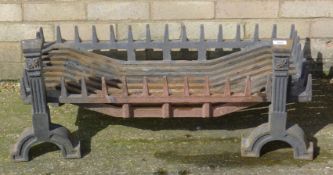 A cast iron fire grate. 105 cm wide.