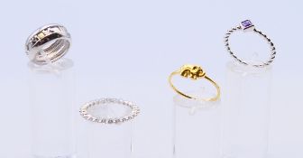 Four silver rings.