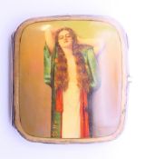 A silver cigarette case with girl decoration. 8 cm x 9 cm.