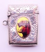 A silver vesta with bull roundel. 4 cm x 3 cm.