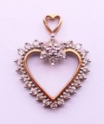 A 9 ct gold heart pendant. 3 cm high.