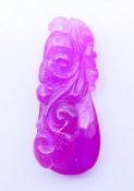 A pink pendant. 6.5 cm high.