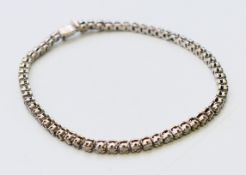 A diamond line bracelet. 18.5 cm long.