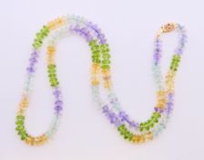 A multi-stone necklace with a 14 ct gold clasp. 45 cm long.