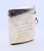 A large silver vesta engraved 'Presented to the Rev J C Barker by members of the Shanty Club,