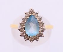 An 18 ct gold topaz ring. Ring size O/P.