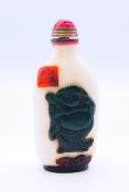 A white and green Peking glass snuff bottle and stopper. 8.5 cm high.