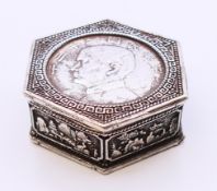 A Chinese white metal coin box. 5.5 cm x 5 cm.