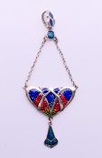 A silver Art Nouveau-style pendant. 8 cm high.