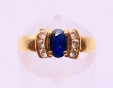 An 18 ct gold, sapphire and diamond ring. Ring size J/K.