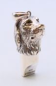 A silver labrador head whistle pendant. 3.5 cm high.