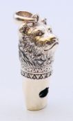 A silver bear's head whistle pendant. 3.5 cm high.