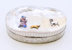 A Continental silver and mother-of-pearl box decorated with enamel figures.