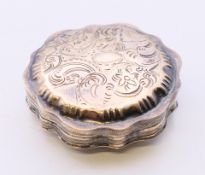 A silver snuff box. 6 cm diameter.