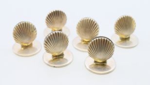 A set of six Tiffany silver shell form menu/place card holders. Each 2 cm high.