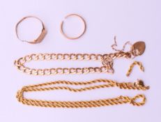 A 9 ct gold chain, a 9 ct gold bracelet and two 9 ct gold rings.