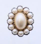 A silver pearl cluster ring. Ring size P/Q.
