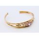 A 9 ct gold bracelet. 6 cm diameter. 6.4 grammes total weight. - Image 1 of 6