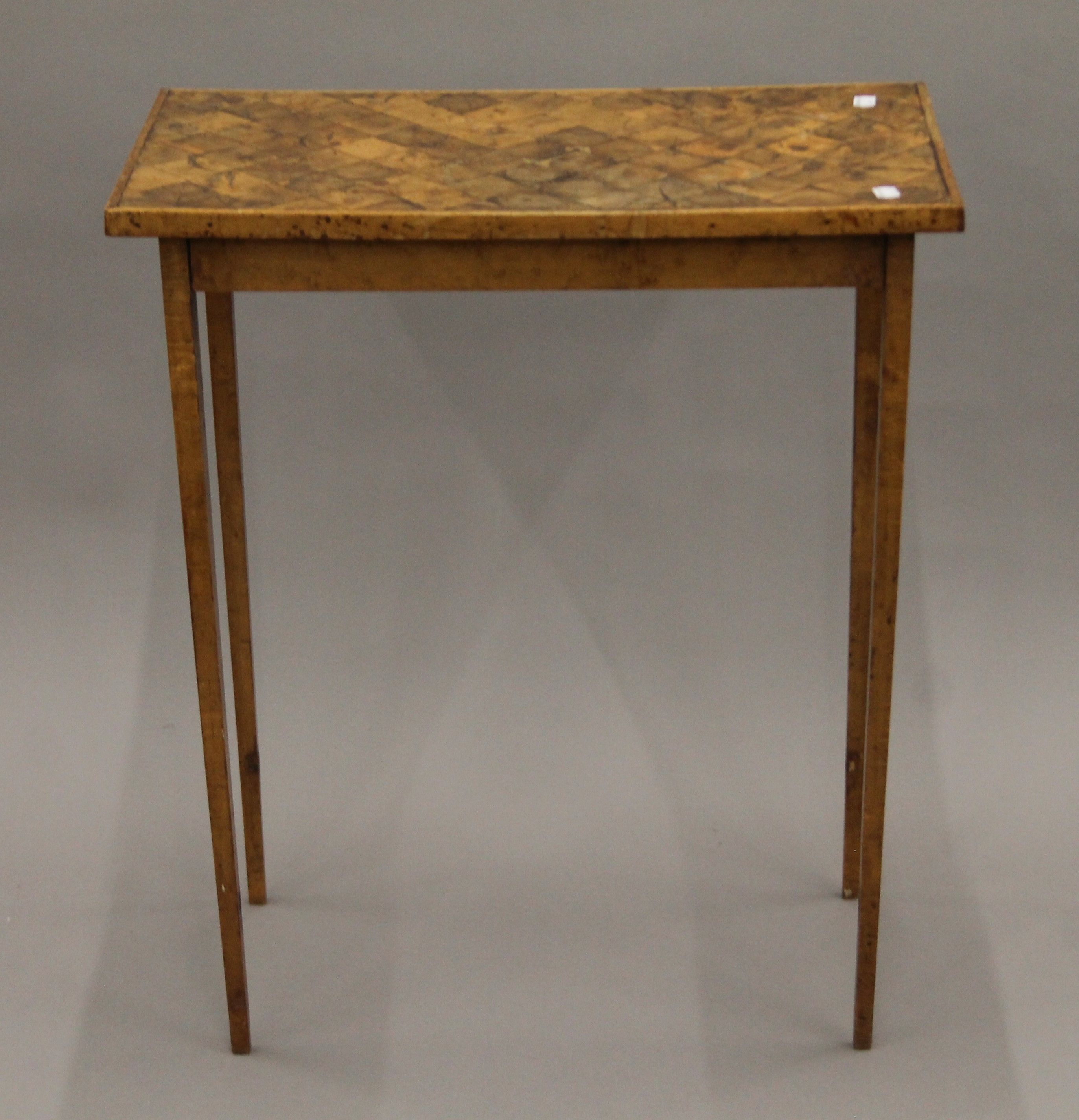 A 19th century oyster-veneered occasional table. 62 x 36 cm.