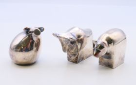 Three Dansk silver plated modernist animal figure paperweights of a pig, a polar bear and a bull.