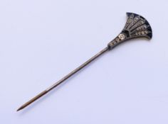 An Art Deco stick pin. 6.75 cm high.