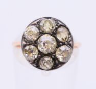 A Russian 14 ct gold seven stone diamond ring, marked 56.