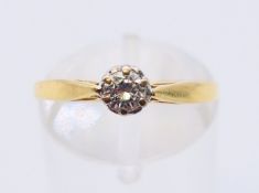An 18 ct gold diamond solitaire ring. Ring size N.