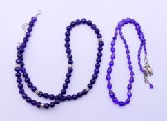 Two amethyst necklaces. The largest 60 cm long.