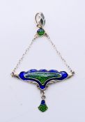 An Art Nouveau style silver pendant. 7 cm high.