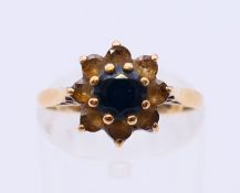 A 9 ct gold and sapphire ring. Ring size M.